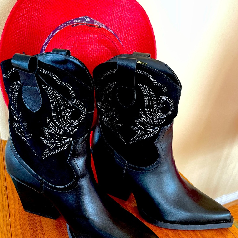Brand new cute boots. Fine detailing in new condition. Black suede tops.